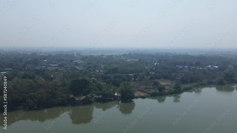Panning Shot of the Mae Klong River in Ratchaburi, Thailand with Scenic Landscape Views from an Aerial Drone in 4K. Panning Shot of the Mae Klong River in Ratchaburi, Thailand with Scenic Landscape Views from an Aerial Drone in 4K.