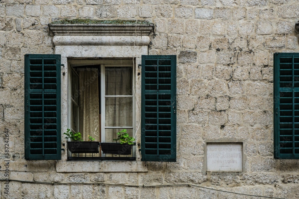 Closeup view of a window on a brick wall building in Montenegro