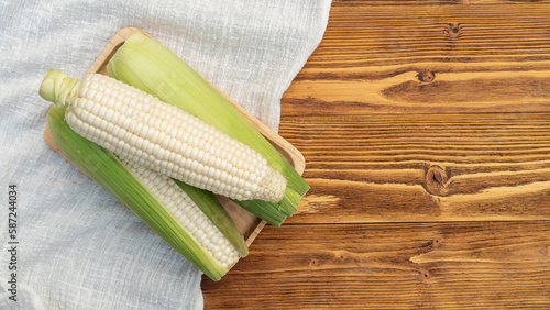 White corn on a wooden table.