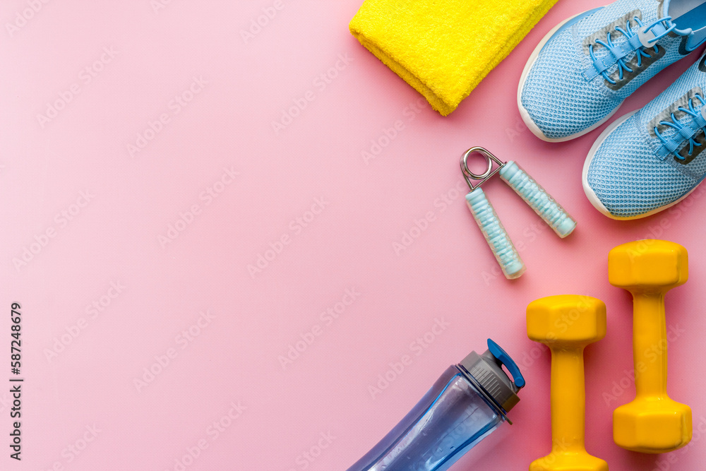 Sport fitness flatlay with sneakers and dumbbells, top view Sport fitness flatlay with sneakers and dumbbells, top view