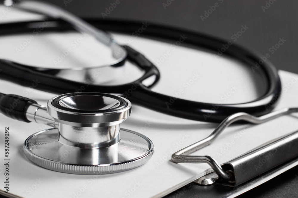 Stethoscope laying on patient information blank. Stethoscope laying on patient information blank.