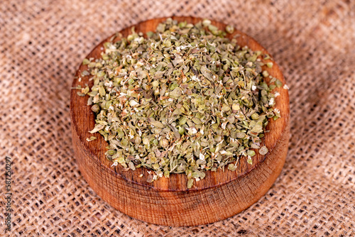 Thyme spice. Dried Thyme leaf in bowl on wood background. Spice concept. Close up