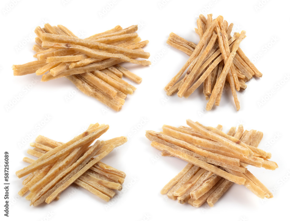 Dried salted tuna meat strips isolated on white background. Snack Fish to beer. Collection. Dried salted tuna meat strips isolated on white background. Snack Fish to beer. Collection.