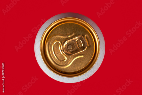 yellow beer can on red background, view from the top