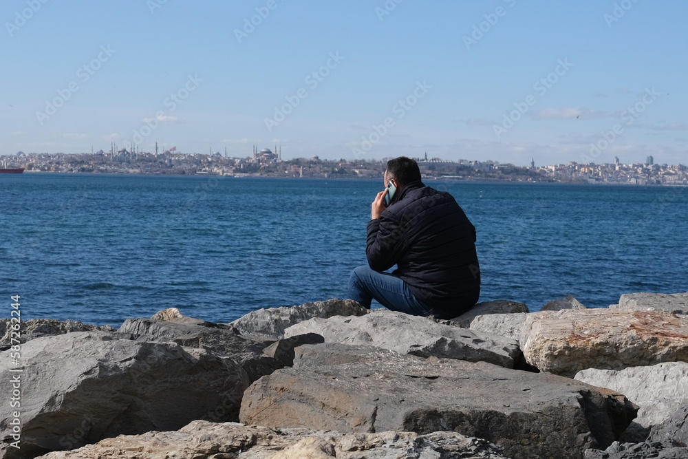 person sitting on the rocks
