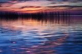 a lake's reflection at sunset and motion blur. Generative AI
