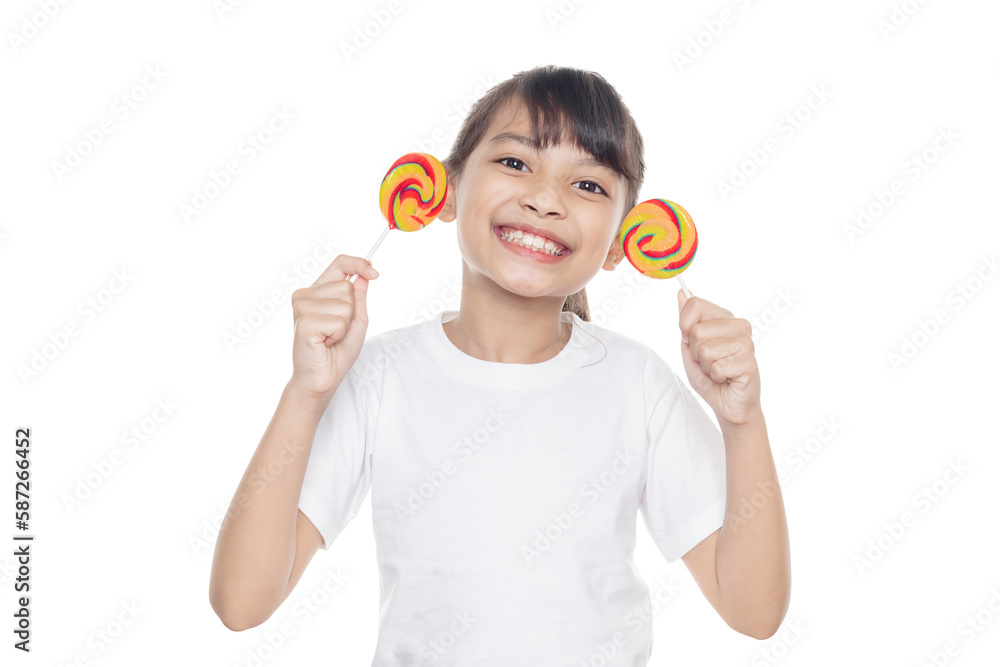 Young Asian girl smiles and holding lollipop candy isolated on white background with clipping path. Young Asian girl smiles and holding lollipop candy isolated on white background with clipping path.