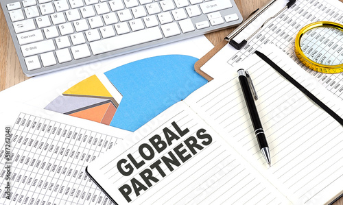 GLOBAL PARTNERS text on paper on chart background