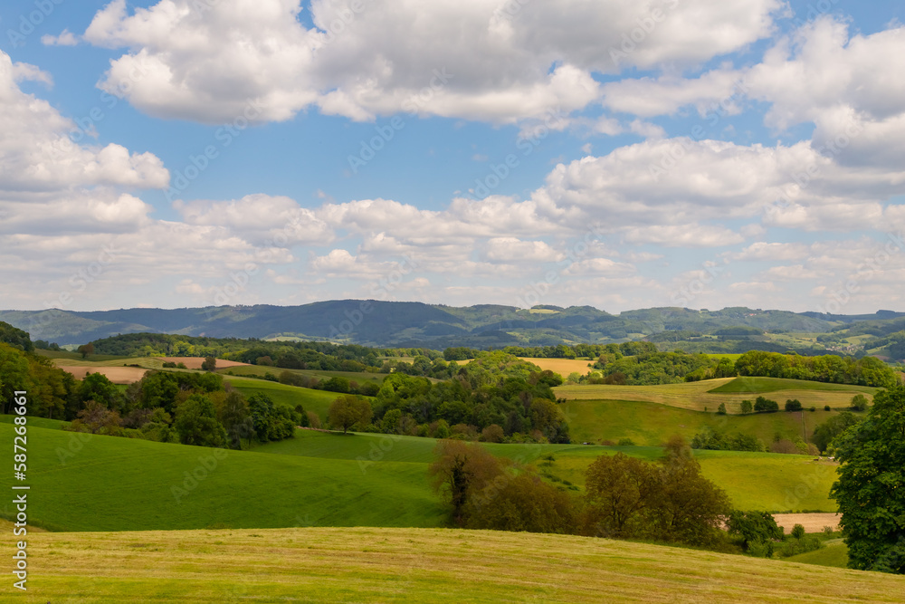 beautiful landscape in summer with fields and meadows in Odenwald region in Germany