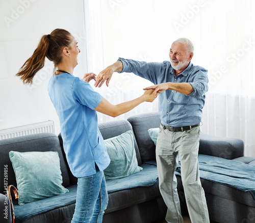 nurse doctor senior care dance dancing fun active patient health help assistence retirement home elderly man © Lumos sp
