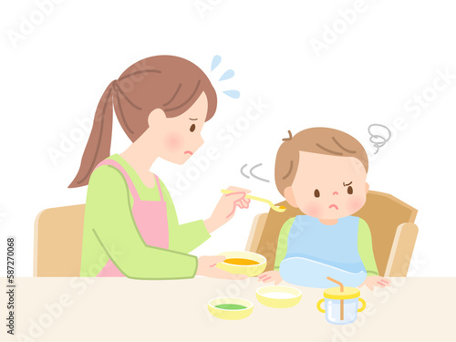 赤ちゃんに離乳食を食べさせるママと嫌がる赤ちゃん