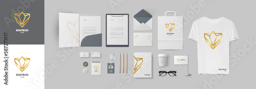 Golden diadem logo and grey premium corporate style set. Stationery branding design with geometric sign and light color gamma. Folder and business card, envelope and A4 form, paper bad and notepad pen