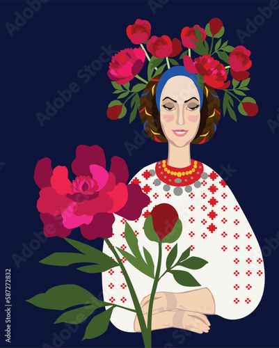 Girl in traditional Romanian clothes with a bouquet of peonies, the symbol of Romania. Folk costume. photo