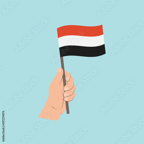 Flag of Yemen, Hand Holding flag photo