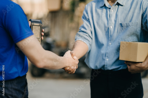 Entrepreneur handshake start business concept of parcel delivery.