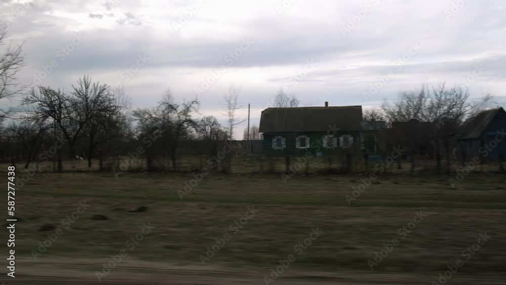 travel view from the car window of village houses, street in the private sector, cloudy weather travel view from the car window of village houses, street in the private sector, cloudy weather