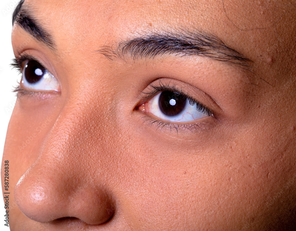 Fototapeta premium Close up of eyes of african american businesswoman against white background