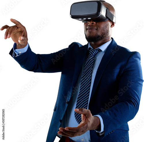 African american businessman gesturing while wearing vr headset against white background