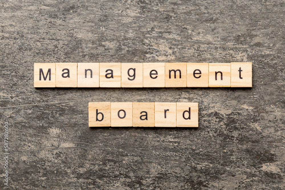Fototapeta premium Management board word written on wood block. Management board text on cement table for your desing, concept