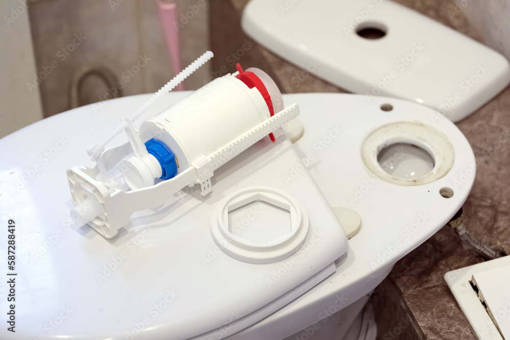 Close-up of a toilet bowl with a new flush mechanism for it Close-up of a toilet bowl with a new flush mechanism for it