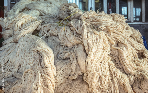 Wool yarns prepared for dyeing on old Bazaar of Kashan, Iran photo