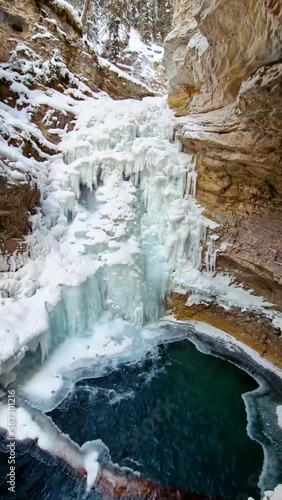 Frozen waterfall. Cascade mountain. Alberta, Canada