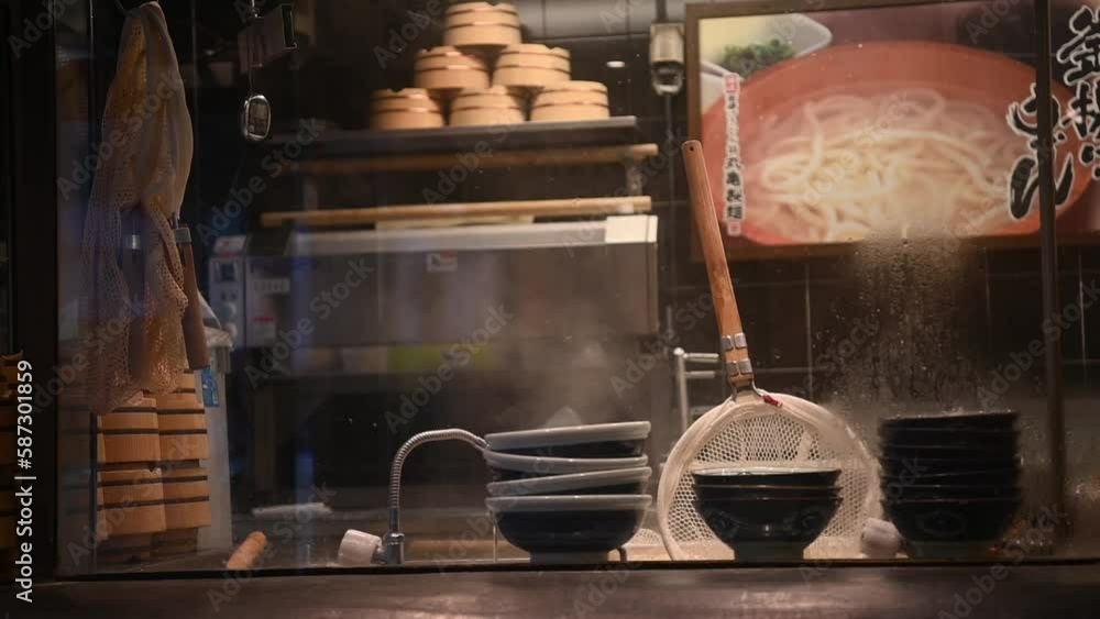 Japanese ramen kitchen Scene. Hot boiling Ramen pot with noodle