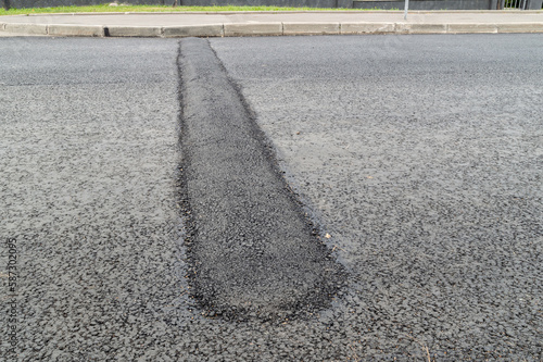 New speed bump on asphalt road