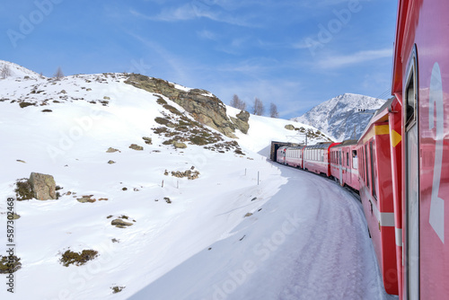 The famous Swiss mountain train of Bernina Express crossed italian and swiss Alps