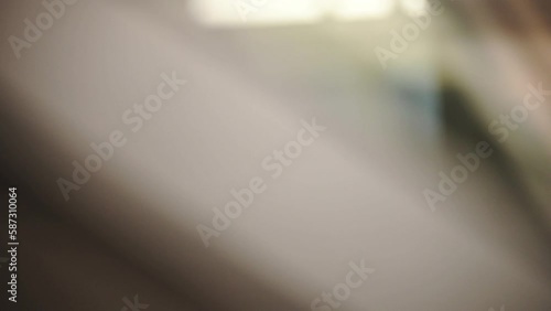 Beautiful bokeh in a dark blurry background at night on the train. The round colorful bokeh shine from building and car lights in traffic on city lifestyle streets. Abstract concept.

