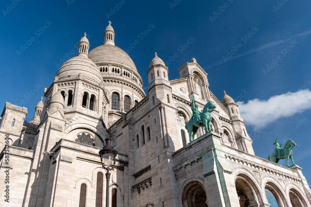 Basilica of Sacré Coeur - front view of domes and statues