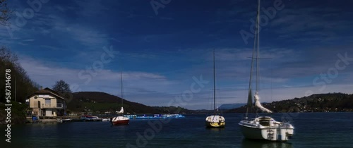 A timelapse of sailboats anchored on Paladru lake, France