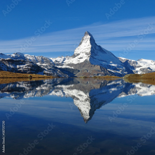 Snow capped Matterhorn mirroring in lake Stellisee photo