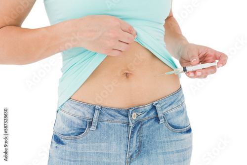 Woman injecting fluid in her stomach