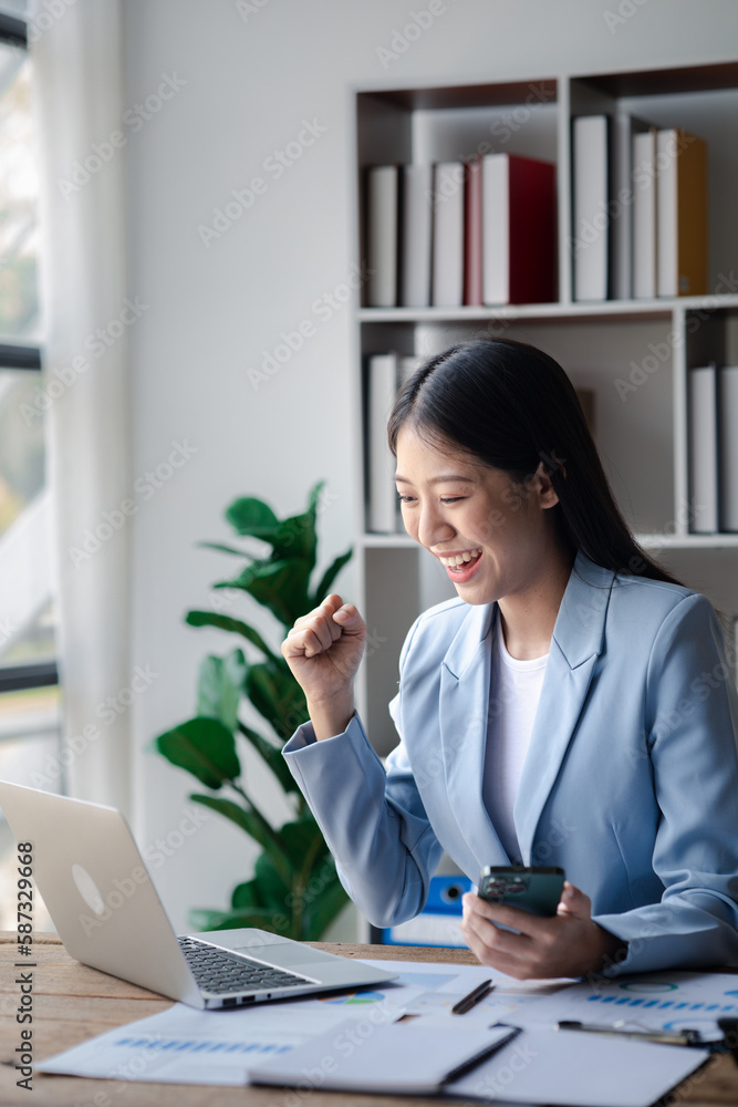 A businesswoman is checking company financial documents and using a tablet to talk to the chief financial officer through a messaging program. Concept of company financial management. A businesswoman is checking company financial documents and using a tablet to talk to the chief financial officer through a messaging program. Concept of company financial management.