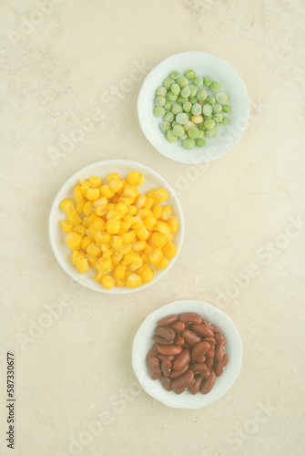 beans, corn and lentils on a white plate in a kitchen top 