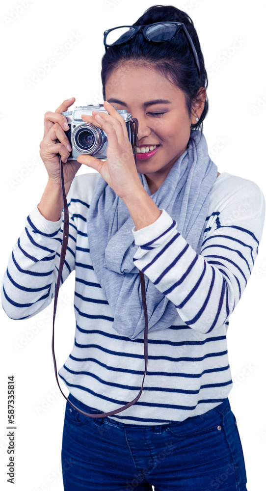 Smiling Asian woman taking photograph with camera Smiling Asian woman taking photograph with camera
