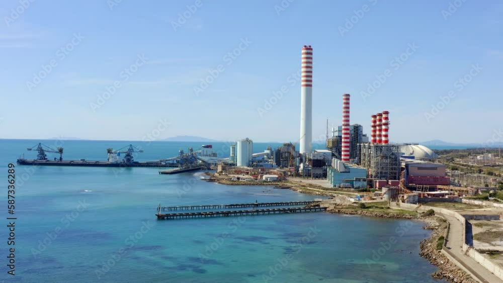 Aerial view on a large thermal power plant built along the coasts of the Mediterranean sea in Civitavecchia, near Rome, Italy. Aerial view on a large thermal power plant built along the coasts of the Mediterranean sea in Civitavecchia, near Rome, Italy.