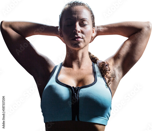 Sporty woman relaxing with hands behind head