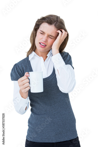 Woman with headache holding mug 