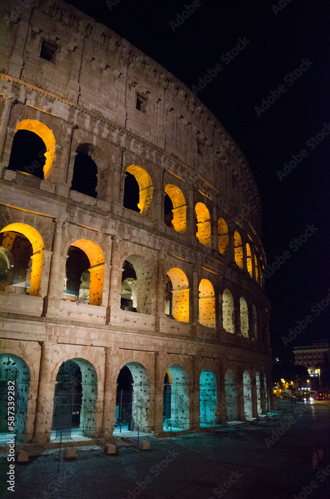 Naklejka premium Colosseum - amphitheater, an architectural monument of Ancient Rome. View of the Colosseum in the evening.