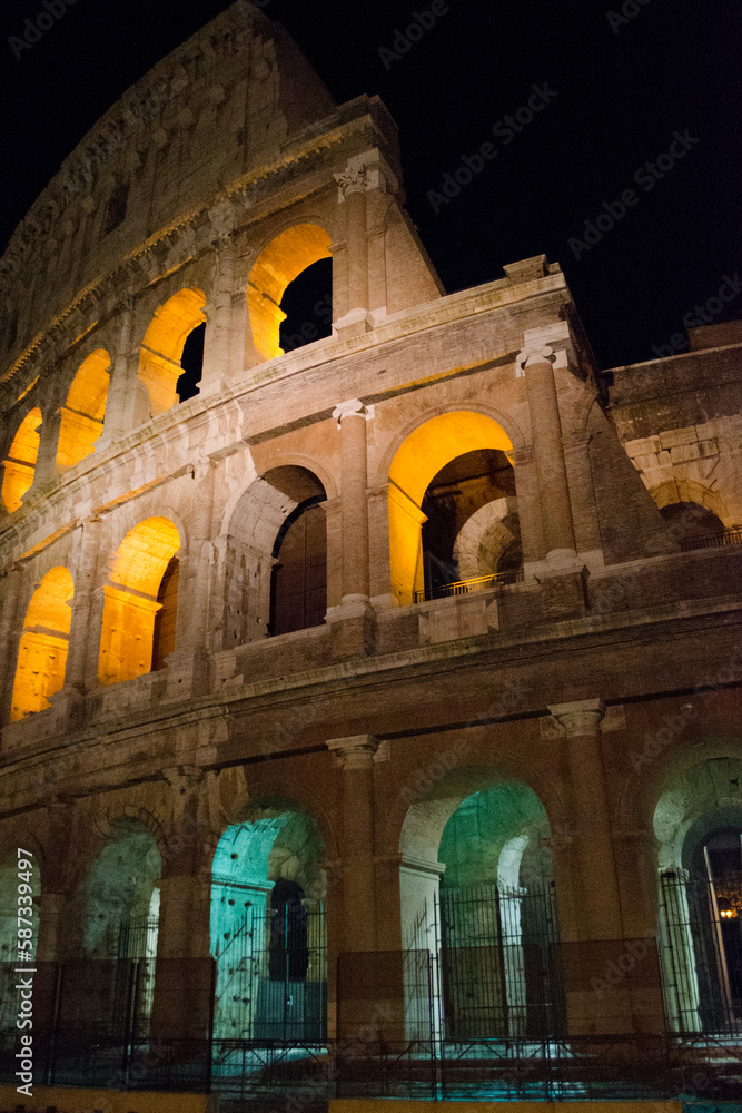 Fototapeta premium Colosseum - amphitheater, an architectural monument of Ancient Rome. View of the Colosseum in the evening.