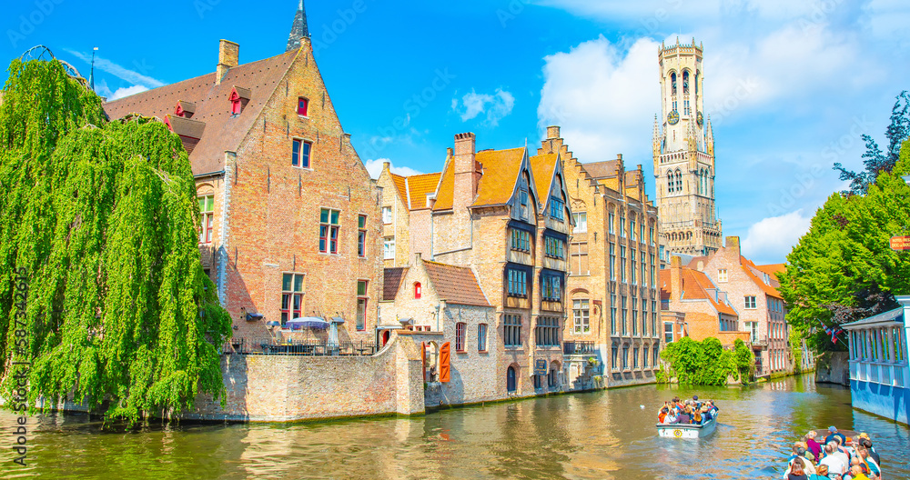 Obraz premium Bruges old town scenic view with water canal and Belfry tower, Belgium
