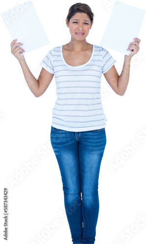 Portrait of beautiful woman crying while holding documents