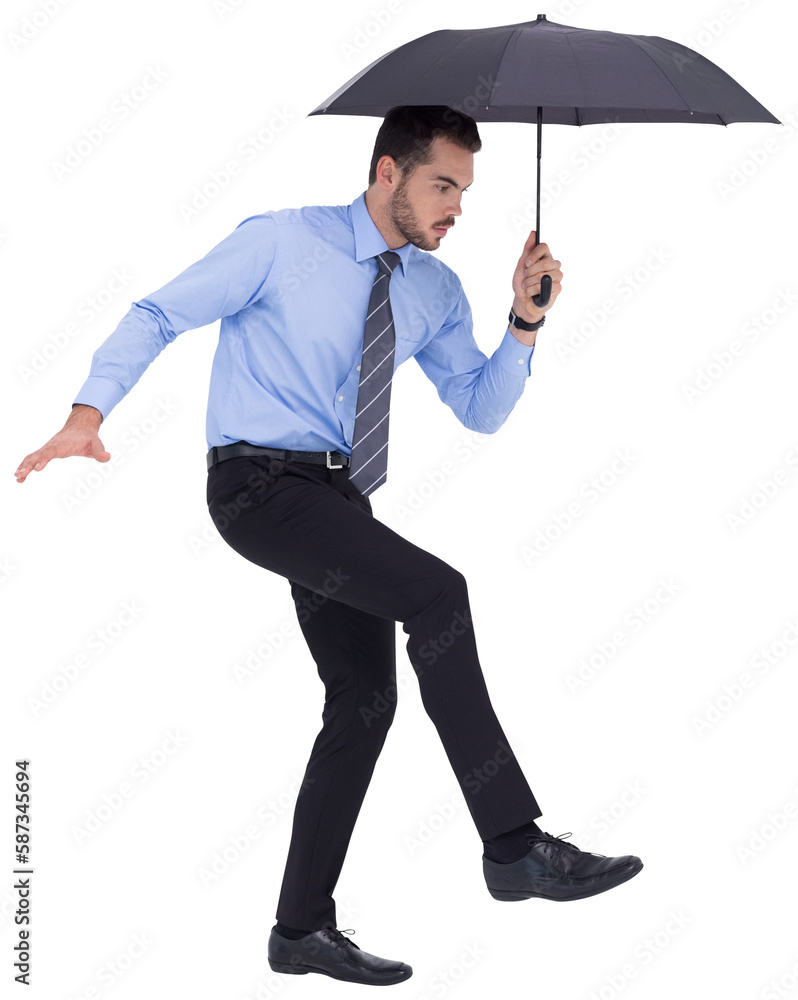 Focused businessman holding umbrella and balancing Focused businessman holding umbrella and balancing
