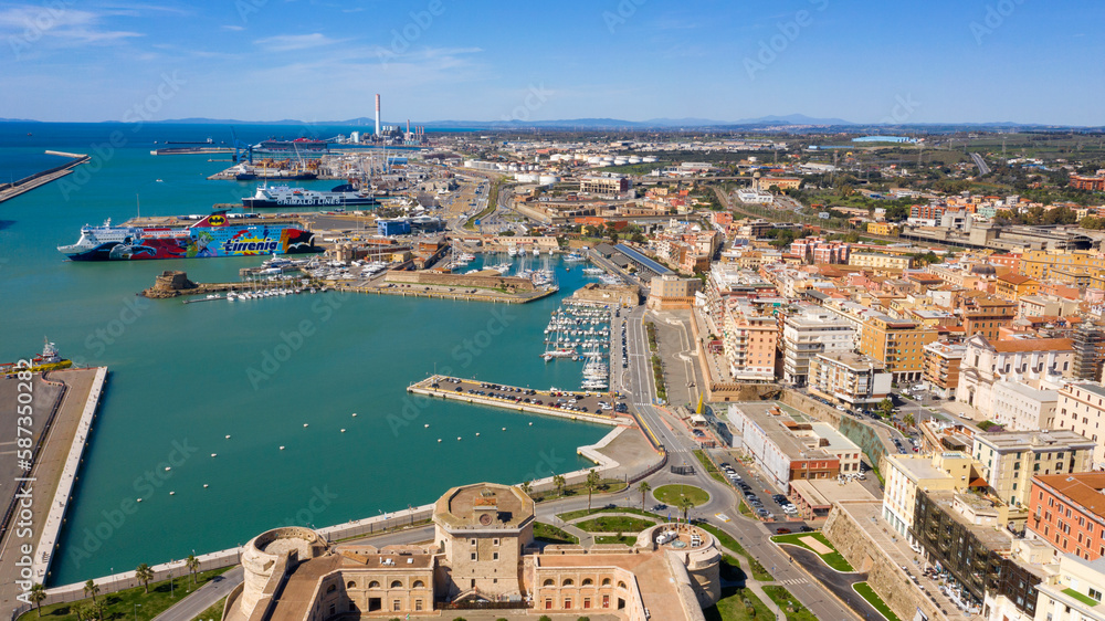 Aerial view of Fort Michelangelo, located in the port of Civitavecchia, in the Metropolitan City of Rome, Italy. In the background are ferries and cruise ships. 