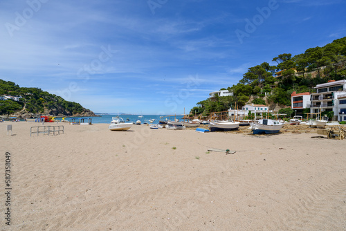 Fishing boats at the beach and the Medes Islands in the background  - June 2018 - Sa Riera, Costa Brava, Catalonia, Spain