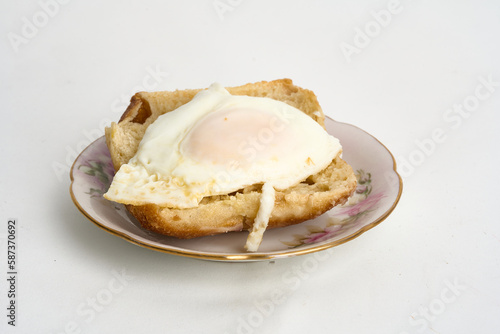egg over toast isolated on white