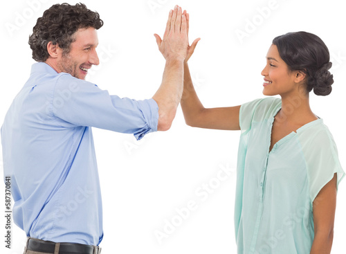 Business people high fiving over white background