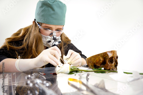 Vászonkép learn to do flower surgery sew up a wound medical student performig surgery under microscope